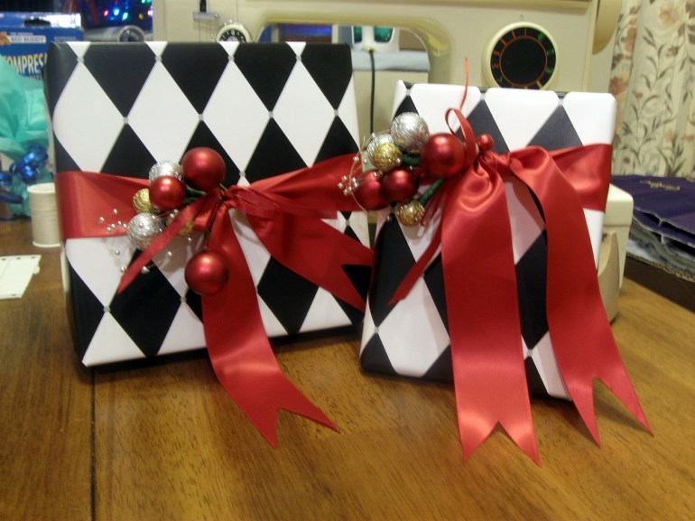 Wrapped presents! I love wrapped presents! And even better, I get to GIVE THEM OUT tomorrow. Eeeeee!!!