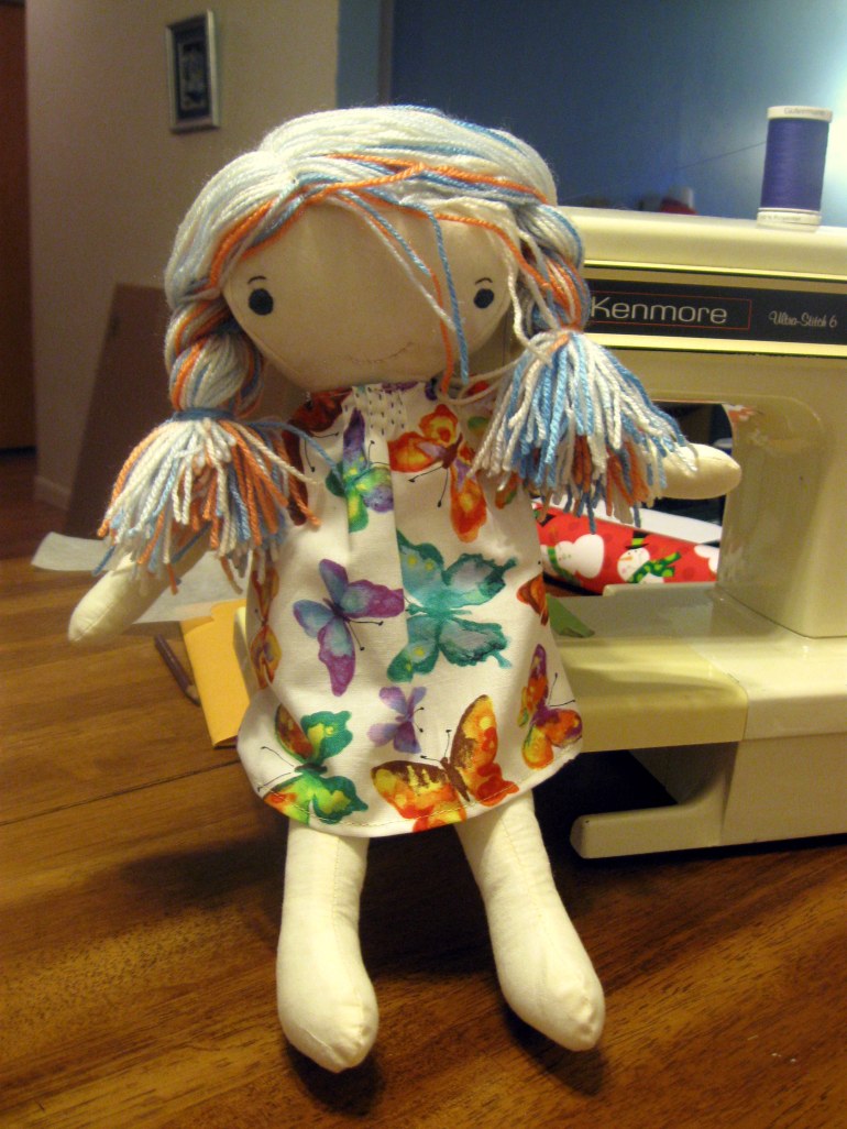 My little girl told Santa she wanted a dolly. Good thing it was on my list already! And now that she has clothes, it's time to wrap.