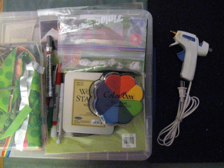 I love gathering supplies. Hot glue, paper, ink pads, fabric...it all jsut comes together so nicely.