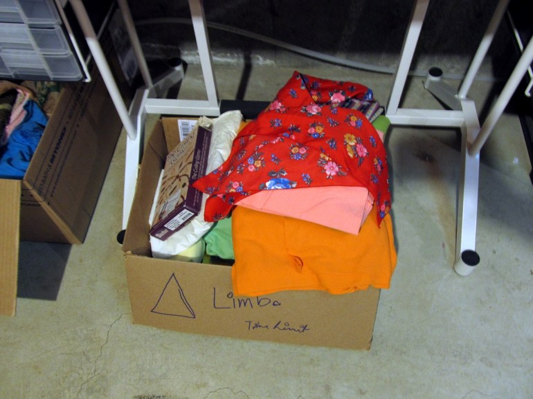 Lookit, a box! Of stuff that I have to kick or keep. Oh, and the triangle on the box? My trick for a three year old who can't read but wants to help sort.