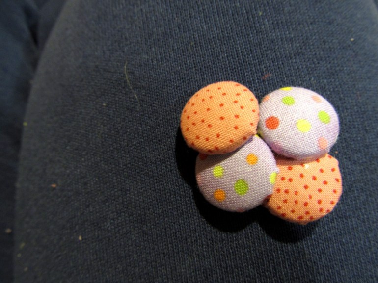 Tiny little fabric buttons. Great use of pretty, pretty prints.