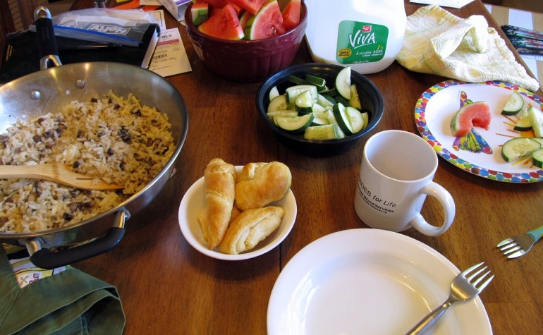 I love eating at our table because it's right next to a big window. Even when there is other junk on the table, it's my favorite place to eat.