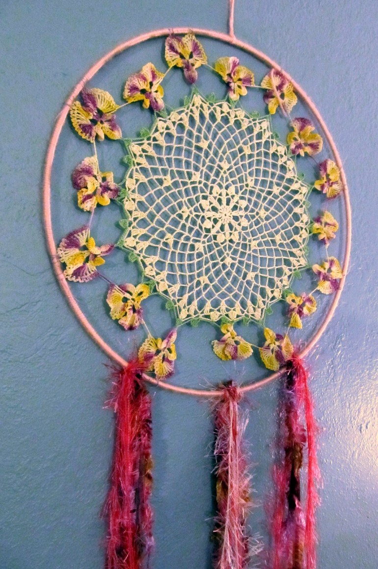 A work in progress for a little lady's nursery. Vintage doily meets lots of pink yarn. Next up, found objects.