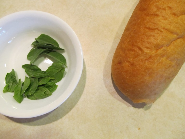 French bread and herbs from my kiddos herb garden. We turned them into pizza.