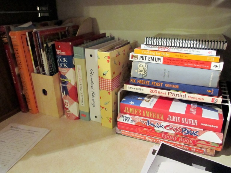 Cookbooks! I should've taken a before picture, but believe me, it was bad. The stacks of books were always collapsing and there were piles of magazine clippings of recipes on top. But I said goodbye to half a dozen books and rearranged. Hopefully this sticks.