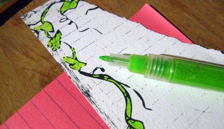 Coloring bits of paper in preparation for collage.