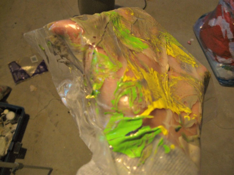 This is why I love acrylics. A matte gel skin with lime green, lemon yellow and interference blue drizzles. This creates a skin of paint that can be placed anywhere on the canvas. Awesome.