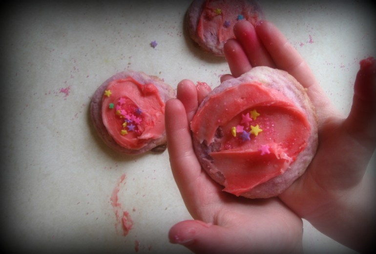 We don't just make cookies here. We make purple cookies with pink frosting, pink sprinkles and rainbow stars. Because they taste better that way.
