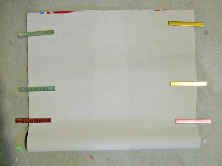 I found these aluminum clips at a garage sale for $1. They work really well for odd sewing items like this that are too heavy for pins.