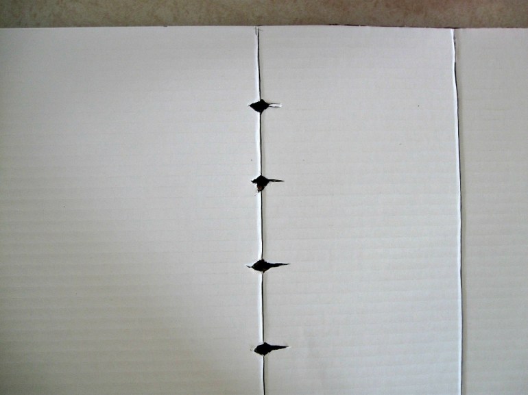 I opted for diamond holes so they were large enough for the charging end of the cord, but the cords get hung up in the corner and don't slide.