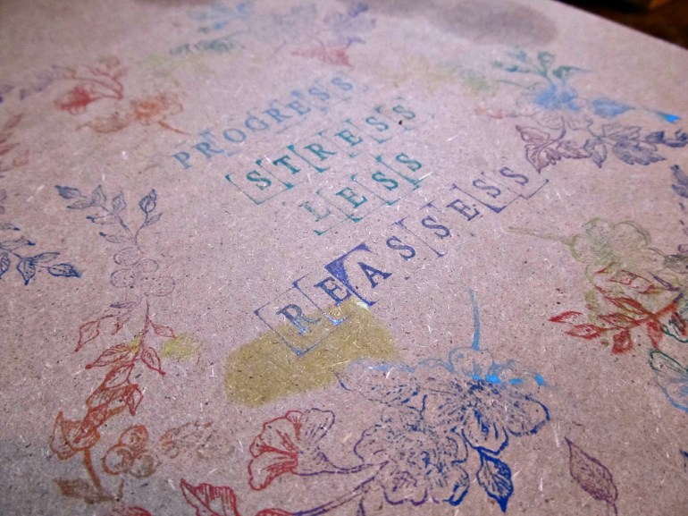 I cleaned and reorganized my jewelry bench...better late than never. I decided it needed a touch of decoration, so I stamped my mantra for the year on it. 