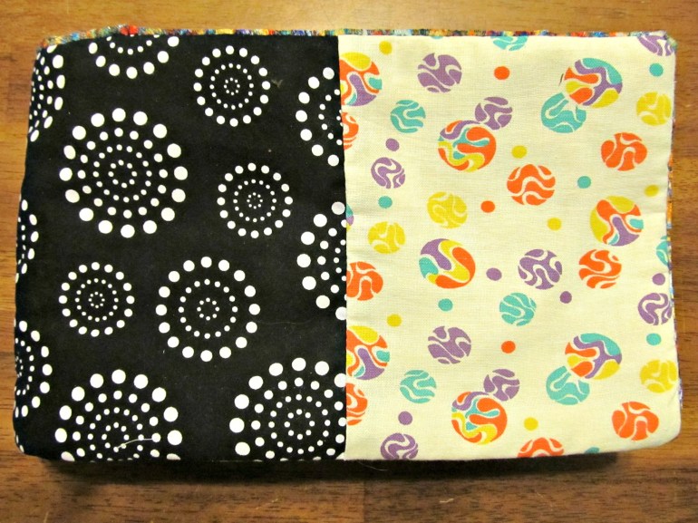 The cover is four pieces of fabric patch worked together. I love both these prints, and they complement each other so well.