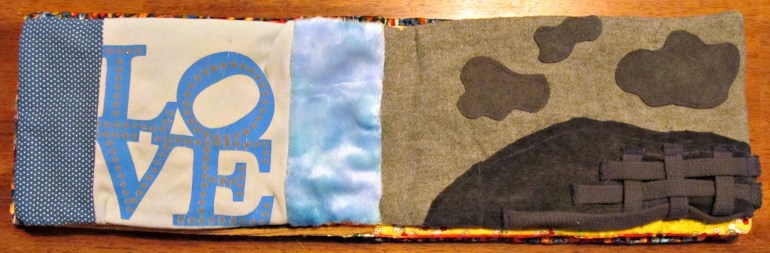 Blue page: Cotton scrap, minky scrap from little man's first Christmas gift and a t-shirt bit.