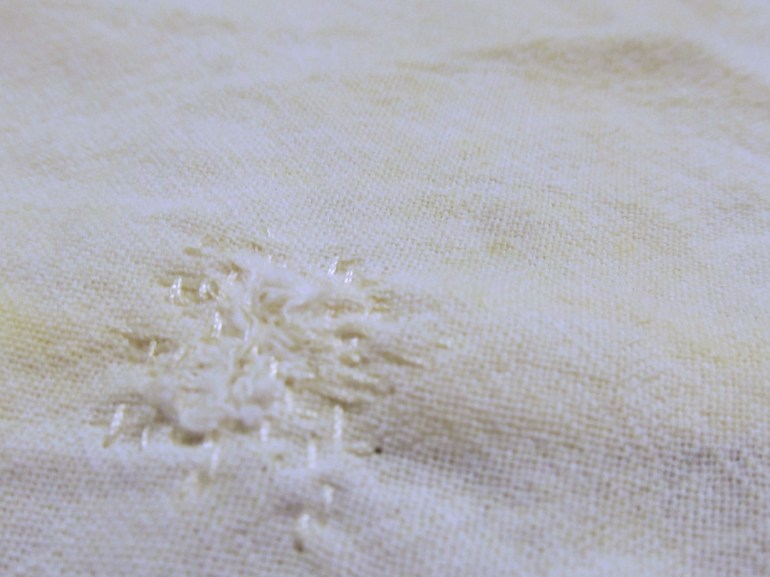 Teeny-weeny thread weaving to patch tiny holes.