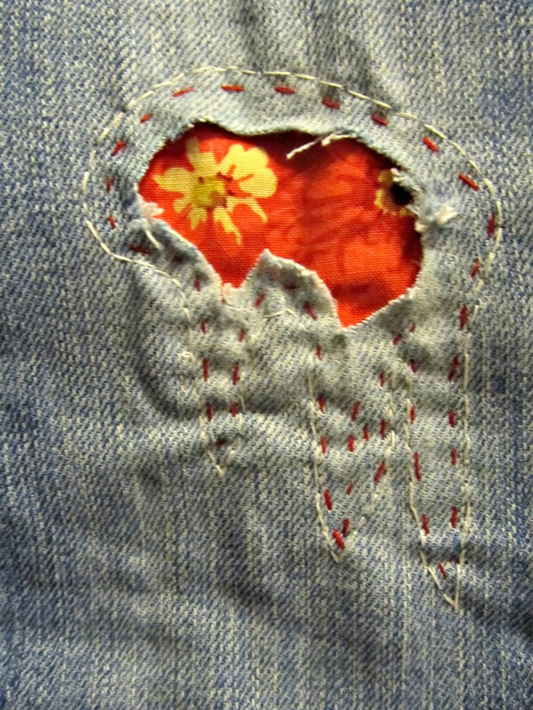 This is a strange patch shape, but I had a reason! I was following the faint lines where the fabric is starting to give more. So I am hoping those long icicle-looking stitches fight that off a bit.