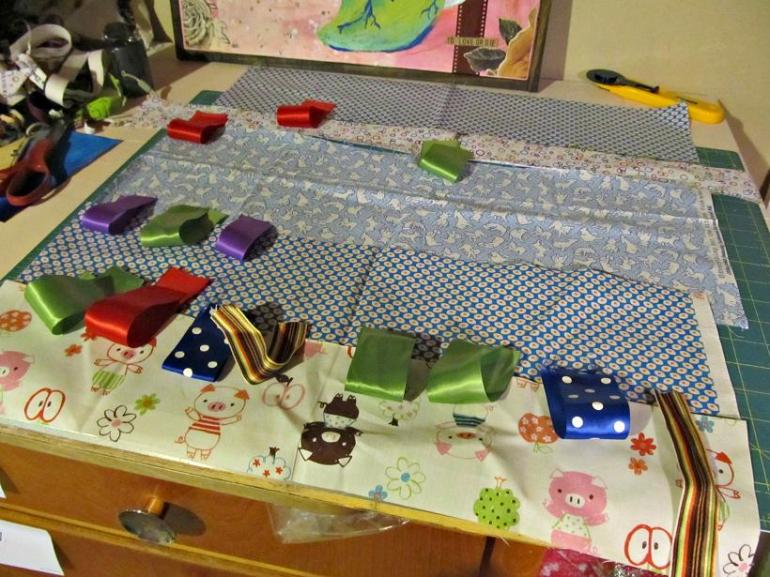 Little man's blanket in progress. My daughter really went with the idea of adding taggies.